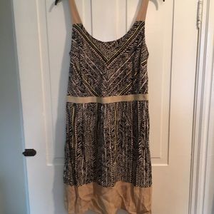 Black, tan, and yellow printed dress.